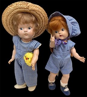 Lot of 2 cute Toddles composition dolls @ approx 8" tall. Re-Dressed in blue gingham with a yellow chick as an accessory, dolls are incised "Vogue Dol