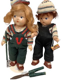 Lot of 2 gardening motif Toddles by Vogue dolls @ approx 8" tall made from composition material. Includes gardening shears, rake and animal cracker bo