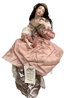 Porcelain artist doll "Daphne" by Monika. 16" in seated position, shoulder head lady with mohair wig, molded and painted facial features, cloth body w