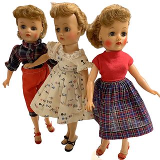 Lot of 3 Little Miss Revlon dolls in vinyl @ 10 1/2" tall. Two dolls have earrings, all retain their shoes. Doll in cream dress has a loose head.