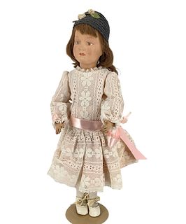 Schoenhut wood doll, pat. Jan 17, 1911, USA & Foreign Countries, @ approx 19" tall. She has a re-painted face. Newer outfit, hands are in rough condit