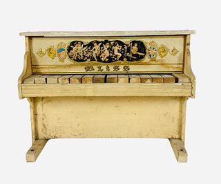Child's Bliss 12-key piano. Painted wood with lithograph applique on front. Overall measurements 14" wide, 10 1/2" tall, 8" deep. Overall wear and sta