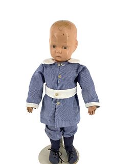 Schoenhut all wood toddler. 14" doll with carved and molded head, painted hair and facial features, on spring jointed wood body, redressed. Joints are