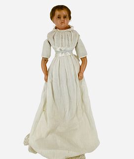 Early poured wax shoulder head child. 19" doll with inserted mohair, inset glass eyes, molded facial features, on cloth body with wax lower arms repla