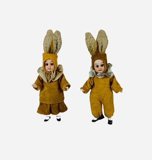 Pair all bisque dolls in bunny costumes. Both are 3 1/2" (excluding ears) tall socket heads with set glass eyes, closed mouths, on five-piece bodies w