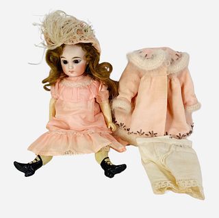 Belton-type bisque head girl. 10 1/4" doll with flattened solid dome crown, holes for stringing, mohair wig, stationary glass eyes, closed mouth, on c