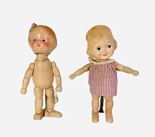 (2) 9 1/2" composition character dolls by Jos. Kallus. Includes "Joy" with molded and painted hair and facial features, molded loop for bow, on segmen