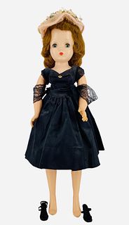 Madame Alexander Cissy. Hard plastic head with synthetic wig, sleep eyes, closed mouth, on hard plastic torso and legs, vinyl arms. Cissy wears her ta