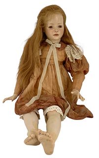 29 1/2" wax over porcelain socket head/shoulder plate doll with open-closed mouth, glass eyes, painted facial features, human wig. Wax is pealing off 