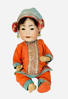 J.D.K. 243 bisque socket head Asian baby. 13" doll with mohair wig, set glass eyes, open mouth with teeth, on five-piece composition bent limb baby bo