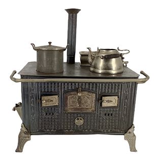 12 1/2" x 10" Early German Doll Tin Stove with (3) Tin pan accessories. Does show some wear and does not sit flush on flat surface. Is heavy regarding