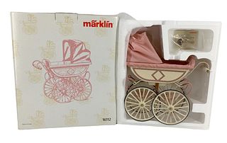 8" x 3" Limited Edition Marklin Reproduction doll carriage brand new in the box (16112) made of metal, wood and cloth material. This limited edition c