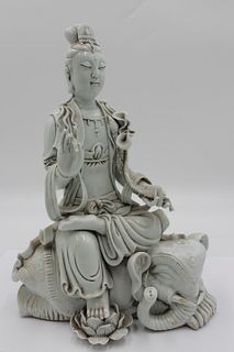 A  Blanc-De-Chine Figure of a Seated Guanyin.