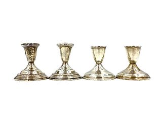 Two Pairs of Weighted Sterling Silver Candlesticks