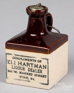 Miniature Eli Hartman stoneware advertising jug