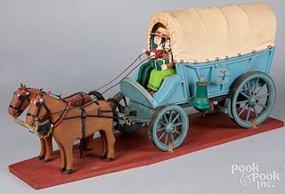 Carved and painted horse drawn Conestoga Wagon