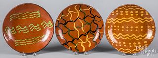 Three Greg Shooner redware plates