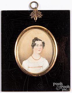 Miniature watercolor portrait of a young woman