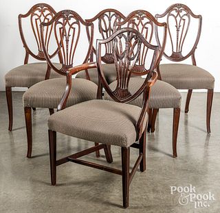 Four English Hepplewhite mahogany dining chairs