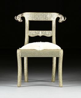 AN ANGLO-INDIAN SILVER METAL AND COWHIDE UPHOLSTERED CHAIR, 20TH CENTURY, 