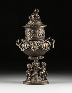 A BELLE ÉPOQUE "FROLICKING PUTTI" PATINATED METAL LIDDED URN, FRENCH, LATE 19TH CENTURY,