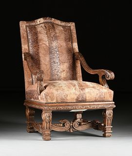 A LOUIS XIV STYLE LEATHER UPHOLSTERED AND CARVED WALNUT TALL BACK ARMCHAIR, BY STANDARD FURNITURE CORP., MODERN,