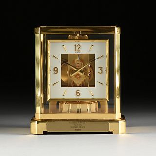 A JAEGER-LECOULTRE GLASS AND POLISHED BRASS ATMOS CLOCK, NO. 497275, SWISS, 1970s,