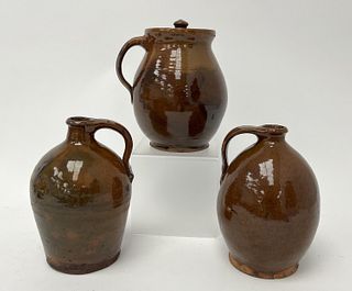 Two Redware Jugs and a Covered Jar