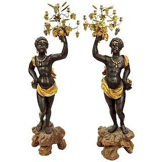 Pair of 19th C Italian Carved Painted and Gilt Wood and gilt tole Blackamoor torchieres. Unsigned. Rubbing, minor surface cracks, losses otherwise goo