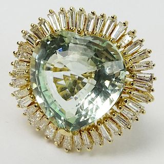 Vintage Approx. 25.0 Carat Heart Shape Aquamarine, 2.5 Carat Baguette Diamond and 14K Yellow Gold Ring. Aquamarine measures approx. 20 x 19mm. Diamond