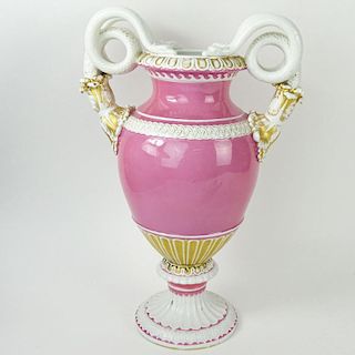 Large Meissen Snake Handle Porcelain Bolted Urn in Pink White and Parcel Gilt. Signed with crossed swords mark. Wear or in good condition. Measures 15