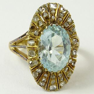 Antique Oval Cut Aquamarine, Rose Cut Diamond and 14 Karat Yellow Gold Ring. Aquamarine with nice even color, VS clarity. Measures 12.95 x 9.0 x 6.0mm