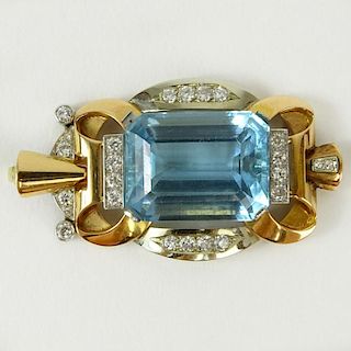 Large Retro Emerald Cut Aquamarine, Round Cut Diamond and 14 Karat Gold Pendant. Set in the center with a gem quality aquamarine measuring 1-1/4" x 3/