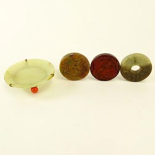 Chinese Archaistic Carved Celadon to Russet Jade Bi Disc; Chinese Carved Russet Jade Pendant Disc; Chinese Carved Blood Red Jade Pendant Disc and a sm