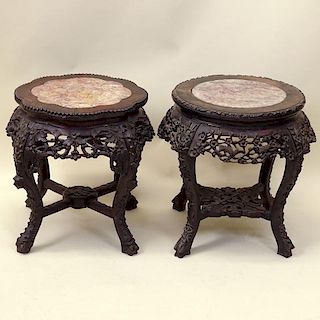 Antique Chinese Carved Hardwood Marble Top Pedestal Tables. Unsigned. Good condition. Measures 19-1/4" H x 16-1/2" dia. Shipping: Third Party.