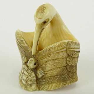 Early 20th Century Japanese Baisho Shop Carved Netsuke In The Form of a Stork and Turtle. Finely Incised. Signed with artist's signature on underside.