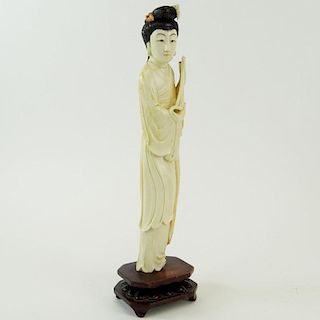 Chinese Carved Polychrome Ivory Maiden Figure on Carved Wood Base. Unsigned. Small losses / damages, repair. Measures 10-1/2" H, 2-1/4" W. This item w