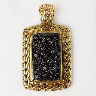 Men's John Hardy 18 Karat Yellow Gold and Black Sapphire Pendant. Signed. Very good condition. Measures 1-3/4 inches long and 1 inch wide. Approx. wei