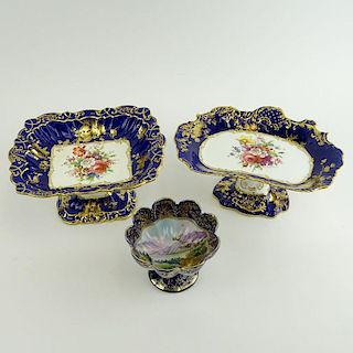 Lot of Three (3) Hand painted Porcelain Compotes. Two Made in England with Floral Motif., One a Nippon with landscape and jeweled motif. Signed. Light