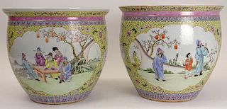 Pair of Mid Century Chinese Famille Rose Porcelain Jardinières. Unsigned. Both with Hairline Cracks. Measures 13-1/2 Inches Tall, 16 Inches Diameter.