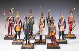 (9) CONTINENTAL MILITARY FIGURINES, ONE SIGNED I.H. ARTHUR