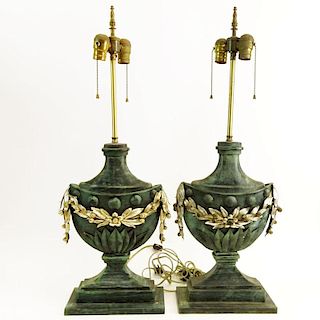 Pair Mid 20th Century urn form tole table lamps. Unsigned. Surface rubbing and wear, minor corrosion. Overall Measures 30" H x 93/4" W at base. Shippi