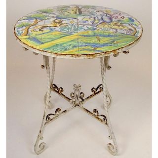 Italian Addison Mizner circa 1920's glazed terracotta tile and wrought iron garden table. Unsigned. Corrosion, crazing, chips to tiles. Measures 31-1/