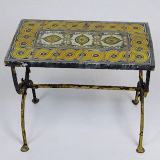 Addison Mizner style circa 1920's glazed terracotta tile and wrought iron garden table. Unsigned. Corrosion, chips to tiles. Measures 19" H x 23" W, S