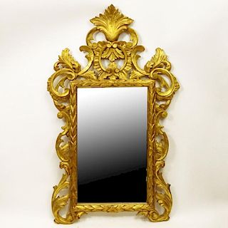 Mid 20th Century Carved Gilt Wood Mirror. Unsigned. Minor surface losses and cracks or in good vintage condition. Measures 45" H x 27" W. Shipping: Th
