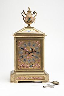 A bronze and enameled porcelain shelf clock