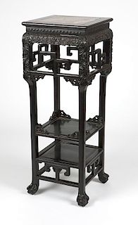 A carved Chinese export hardwood plant stand