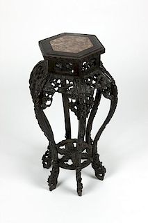 A Chinese export carved hardwood plant stand