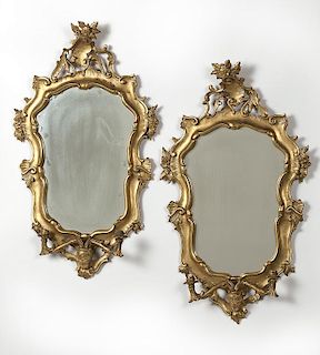 Opposing pair of Italian carved giltwood mirrors