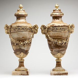A pair of French gilt-bronze and onyx cassoulets
